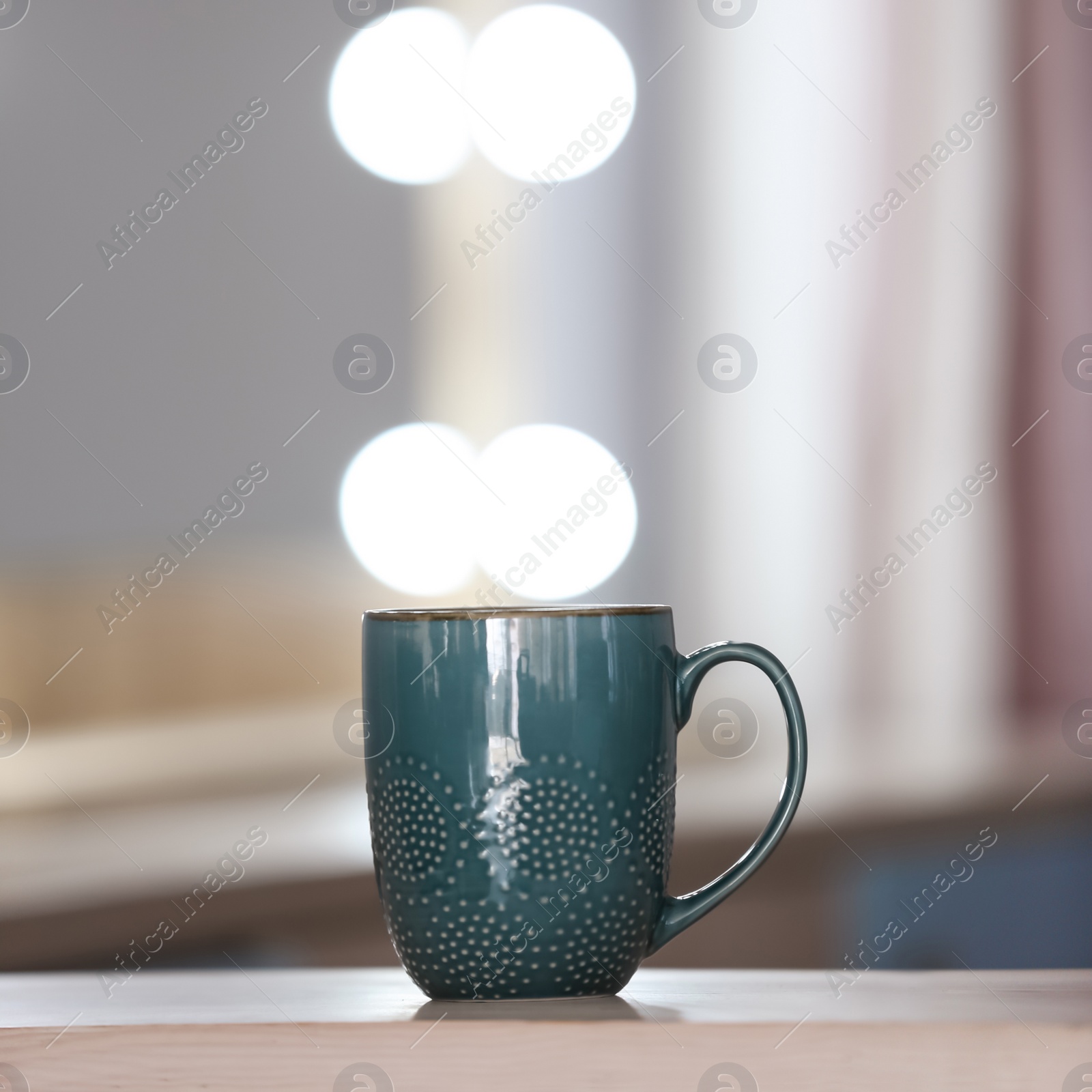 Photo of Cup of aromatic coffee on table