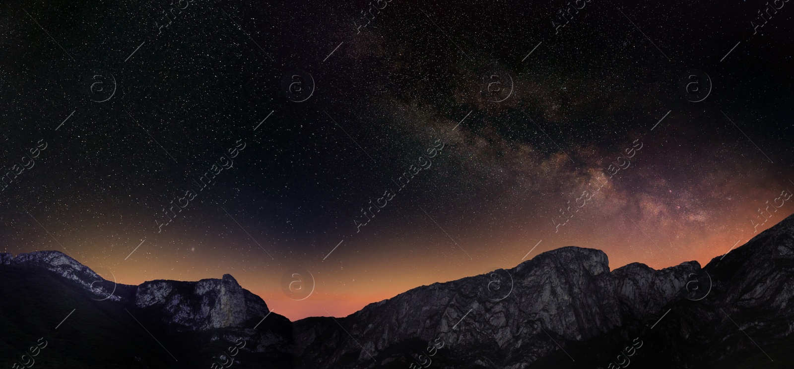 Image of Picturesque view of starry night sky over mountains. Banner design