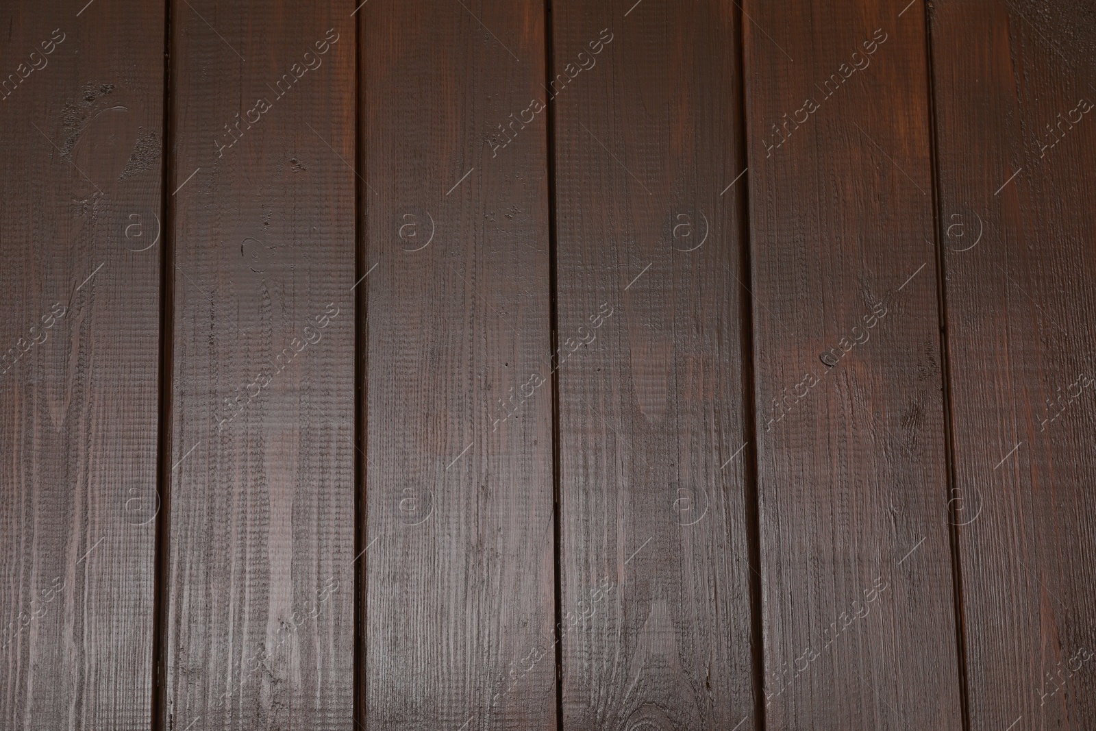 Photo of Texture of dark wooden surface as background, top view