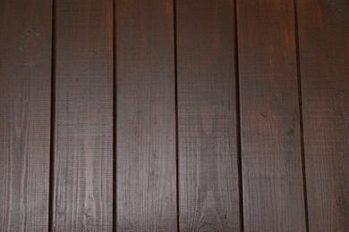 Photo of Texture of dark wooden surface as background, top view