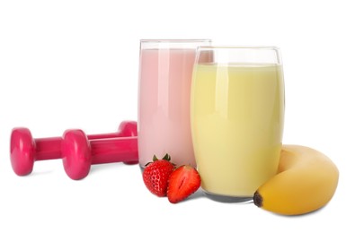 Photo of Tasty shakes, banana, strawberries and dumbbells isolated on white. Weight loss
