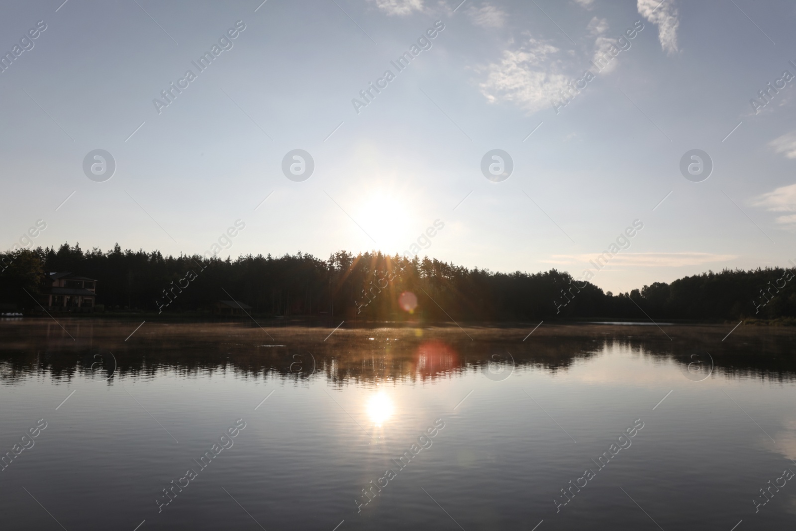 Photo of Beautiful landscape with forest and houses near lake. Camping season