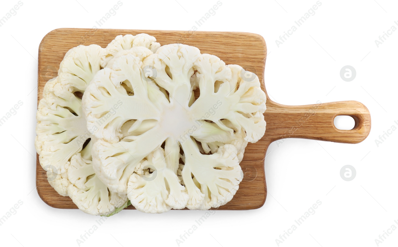 Photo of Wooden board with cut fresh raw cauliflowers on white background, top view