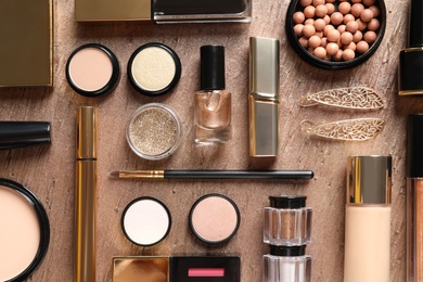 Photo of Set of luxury makeup products on color background, flat lay