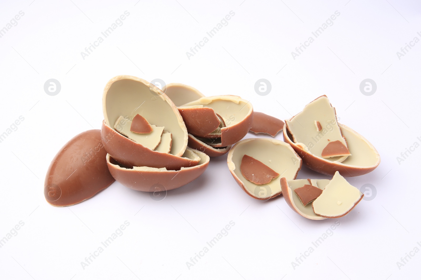 Photo of Sveti Vlas, Bulgaria - July 3, 2023: Broken halves of Kinder Surprise Eggs isolated on white