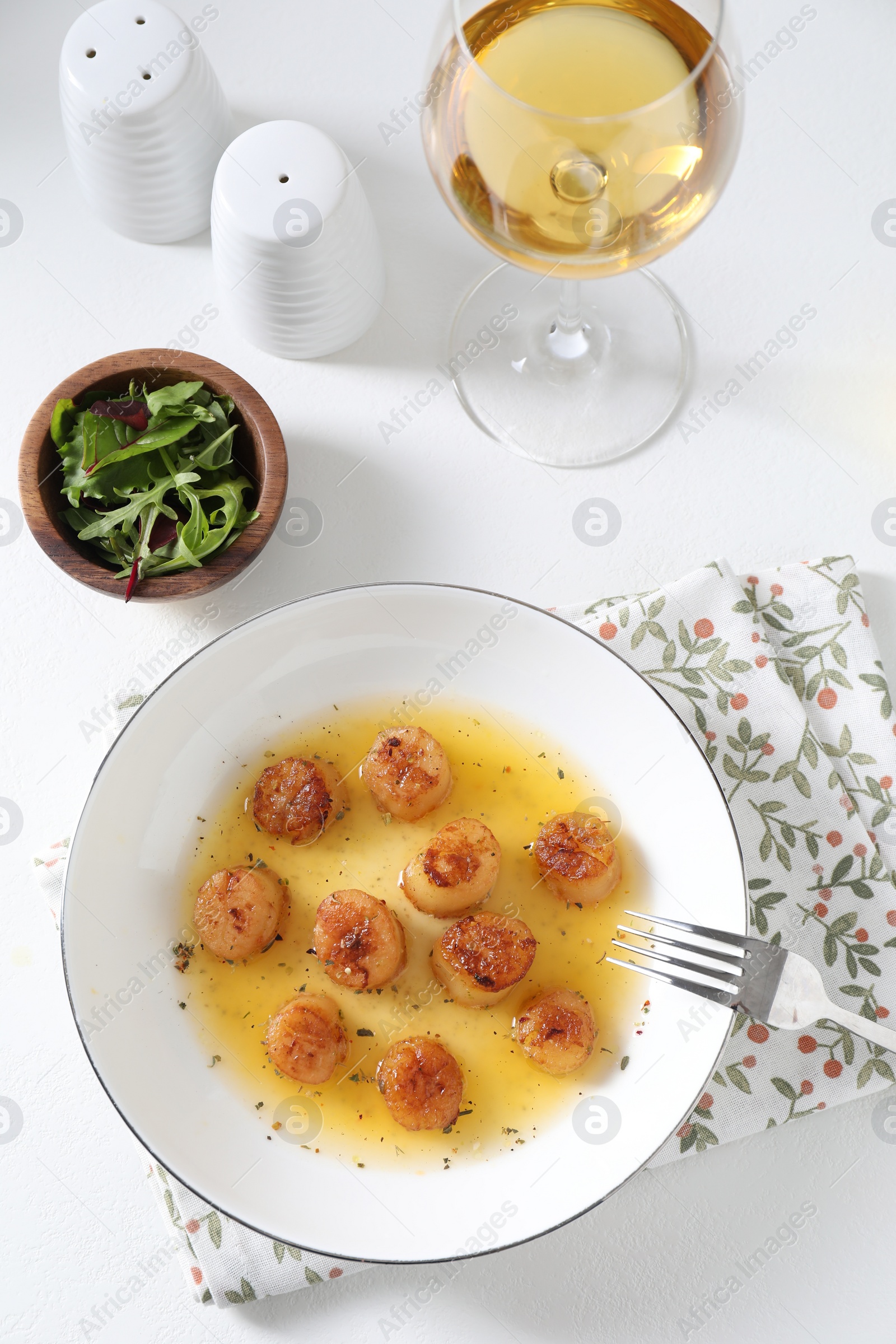 Photo of Delicious fried scallops served on white table, flat lay