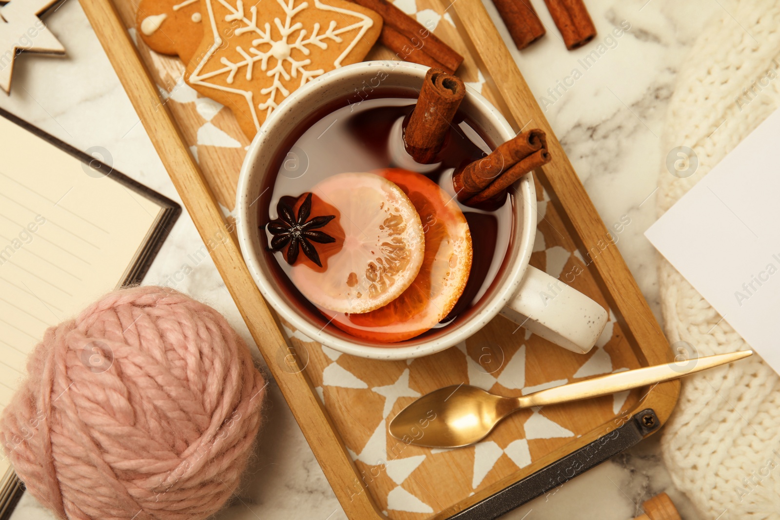 Photo of Flat lay composition with cup of hot winter drink on table. Cozy season