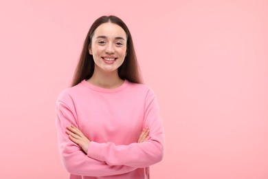 Photo of Beautiful woman with clean teeth smiling on pink background, space for text