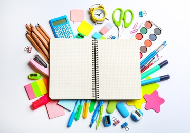 Blank notebook and school stationery on white background, flat lay with space for text. Back to school