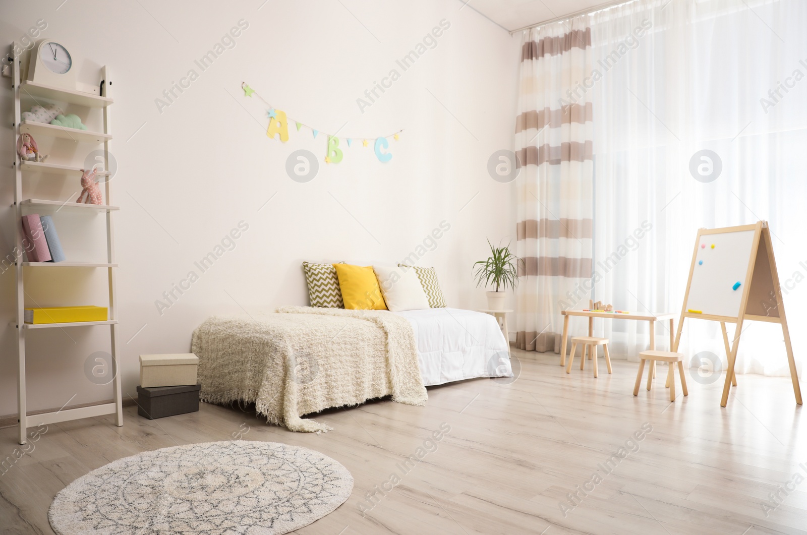 Photo of Modern child room interior with comfortable bed