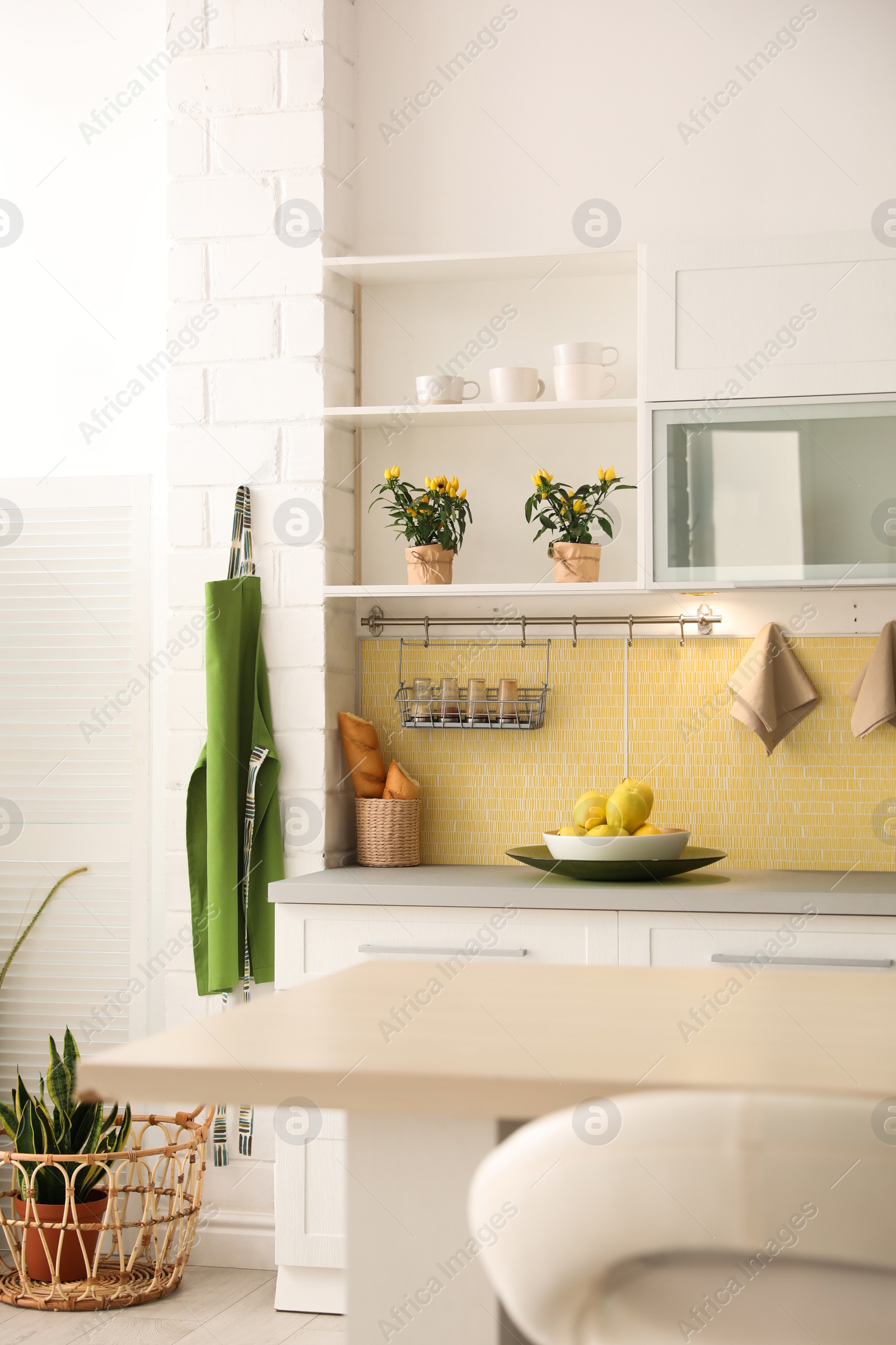 Photo of Modern kitchen interior with stylish white furniture