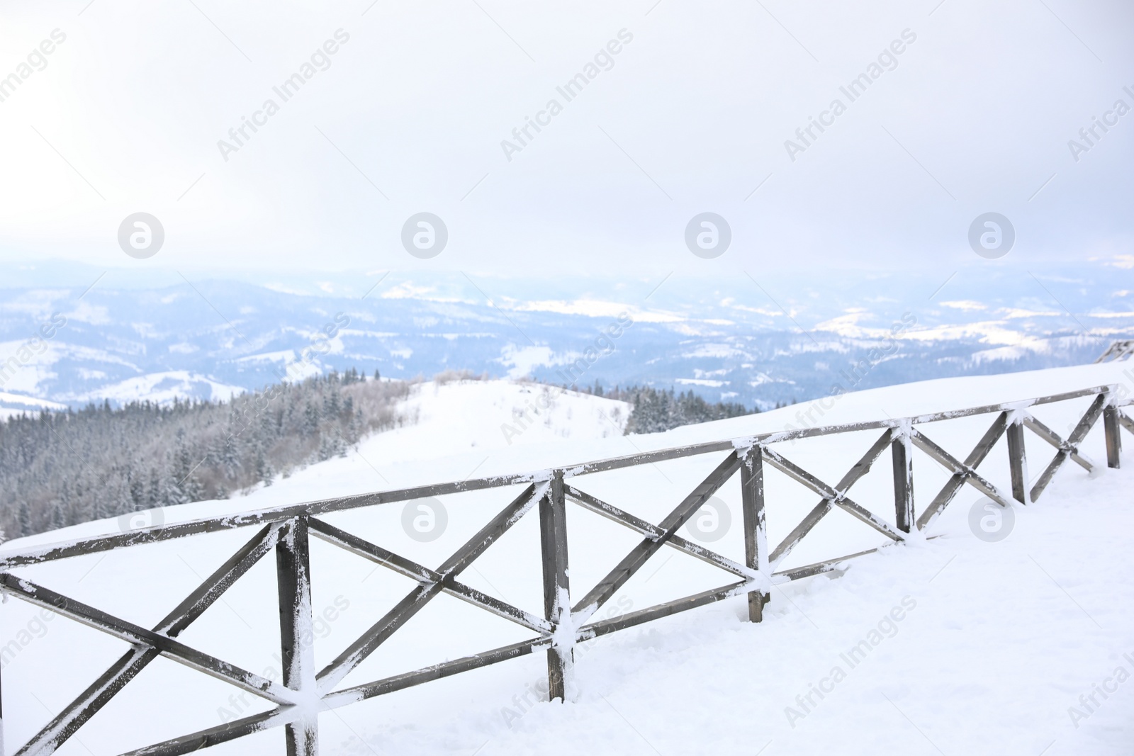 Photo of Picturesque view of snowy hills at mountain resort