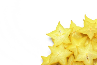 Photo of Pile of delicious carambola slices on white background, top view