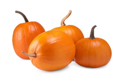 Photo of Many fresh orange pumpkins isolated on white