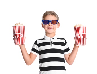 Photo of Cute boy in 3D glasses with popcorn buckets isolated on white