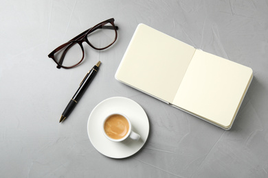 Flat lay composition with coffee on grey table. Tasty breakfast