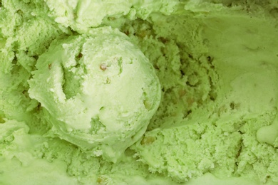 Delicious refreshing pistachio ice cream as background, closeup