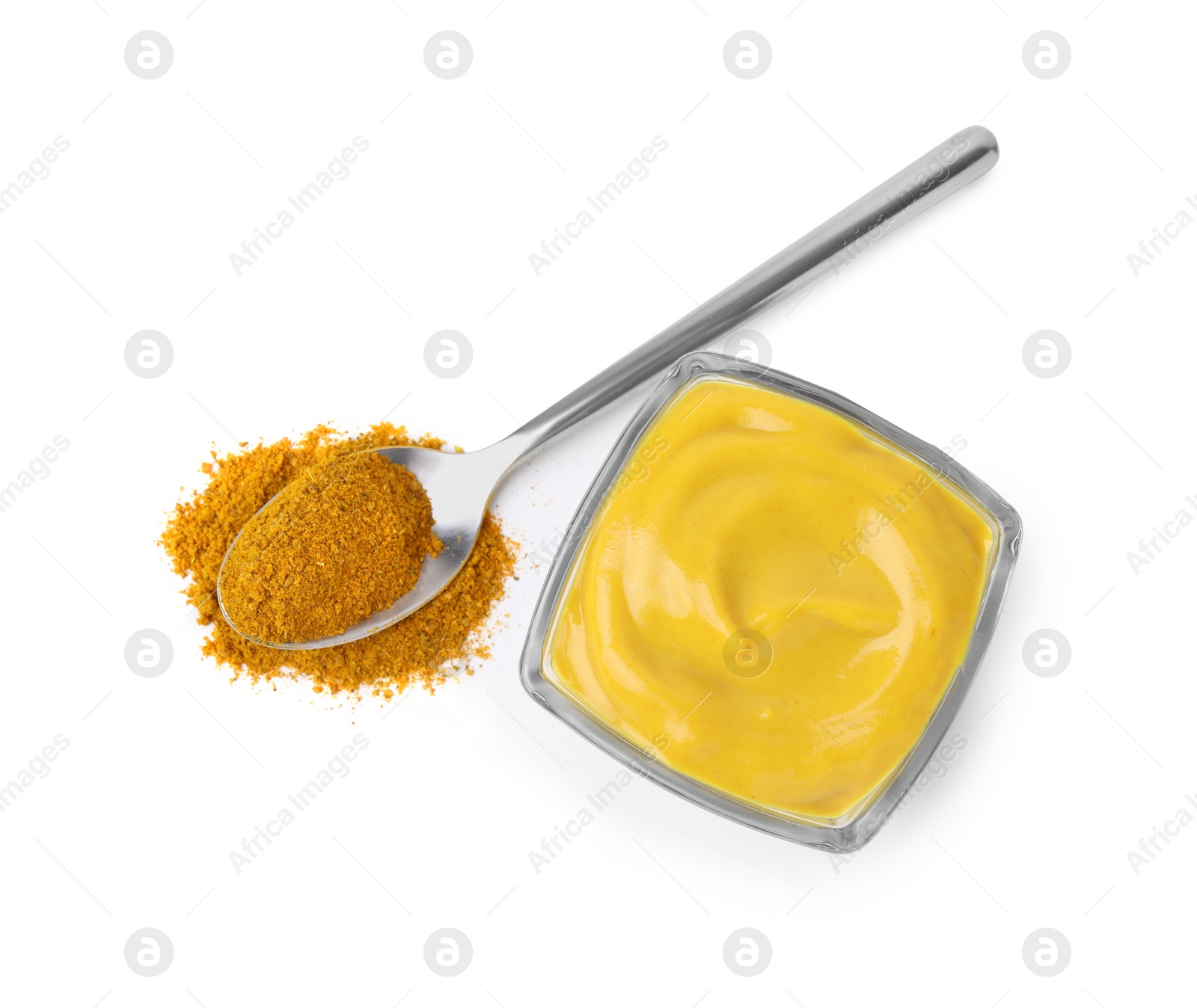 Photo of Tasty curry sauce and powder isolated on white, top view