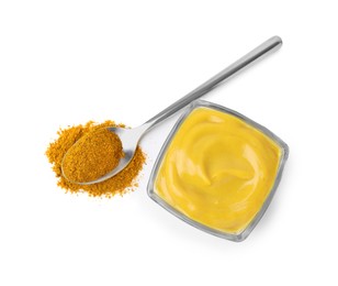 Photo of Tasty curry sauce and powder isolated on white, top view