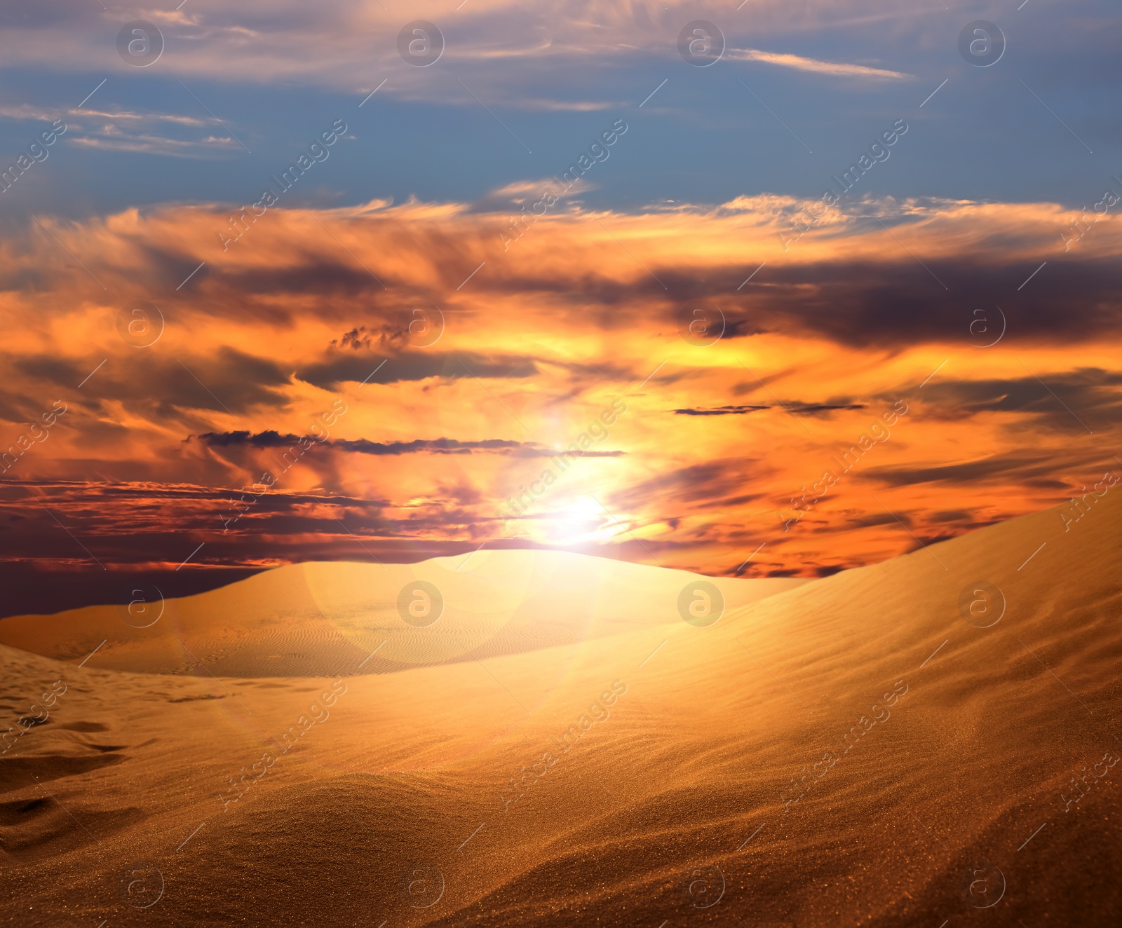 Image of Beautiful view of sandy desert at sunset