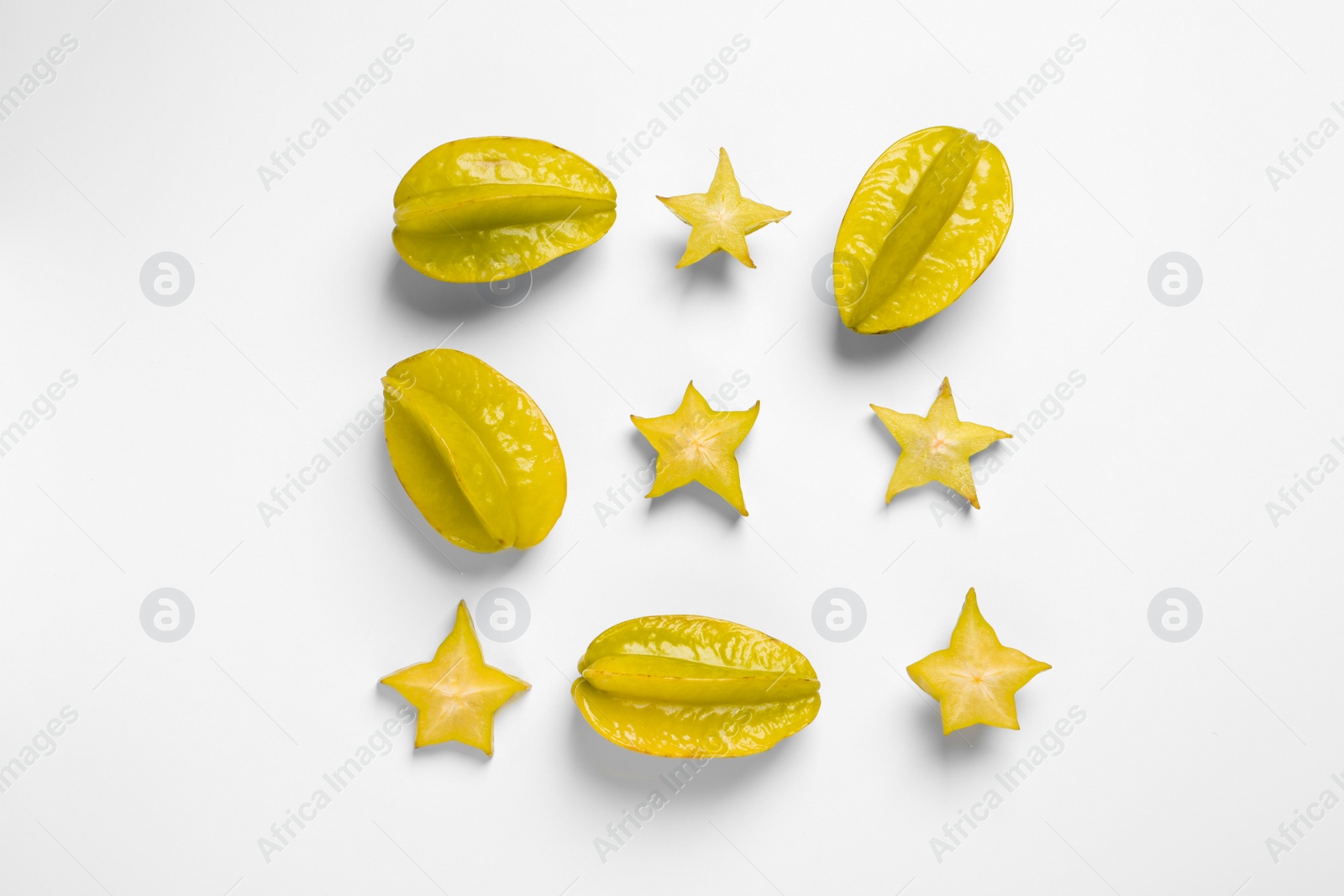 Photo of Flat lay composition with carambolas on white background