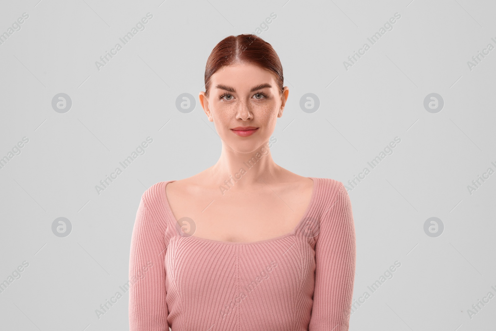 Photo of Portrait of beautiful woman on light background