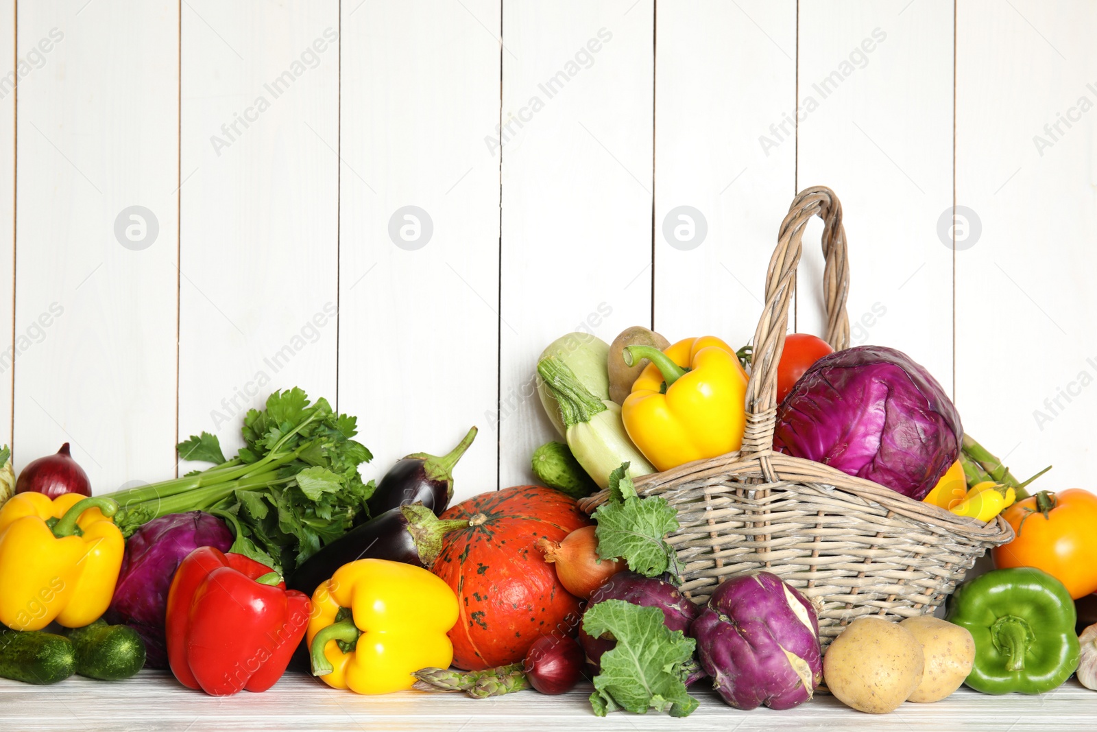 Photo of Many fresh ripe vegetables on wooden background. Organic food