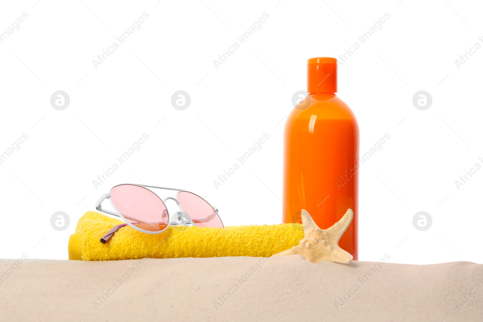 Photo of Different stylish beach accessories on sand against white background