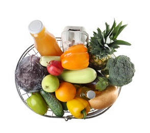 Photo of Shopping basket with grocery products on white background, top view