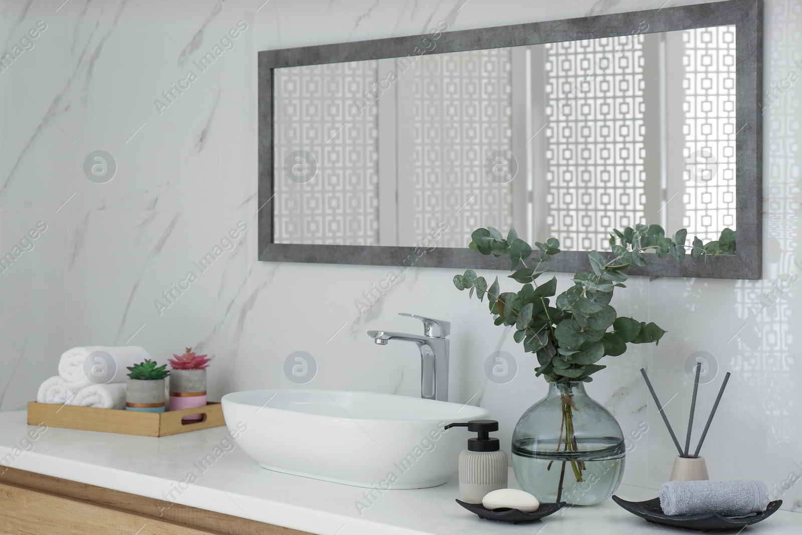 Photo of Modern bathroom interior with stylish mirror and vessel sink