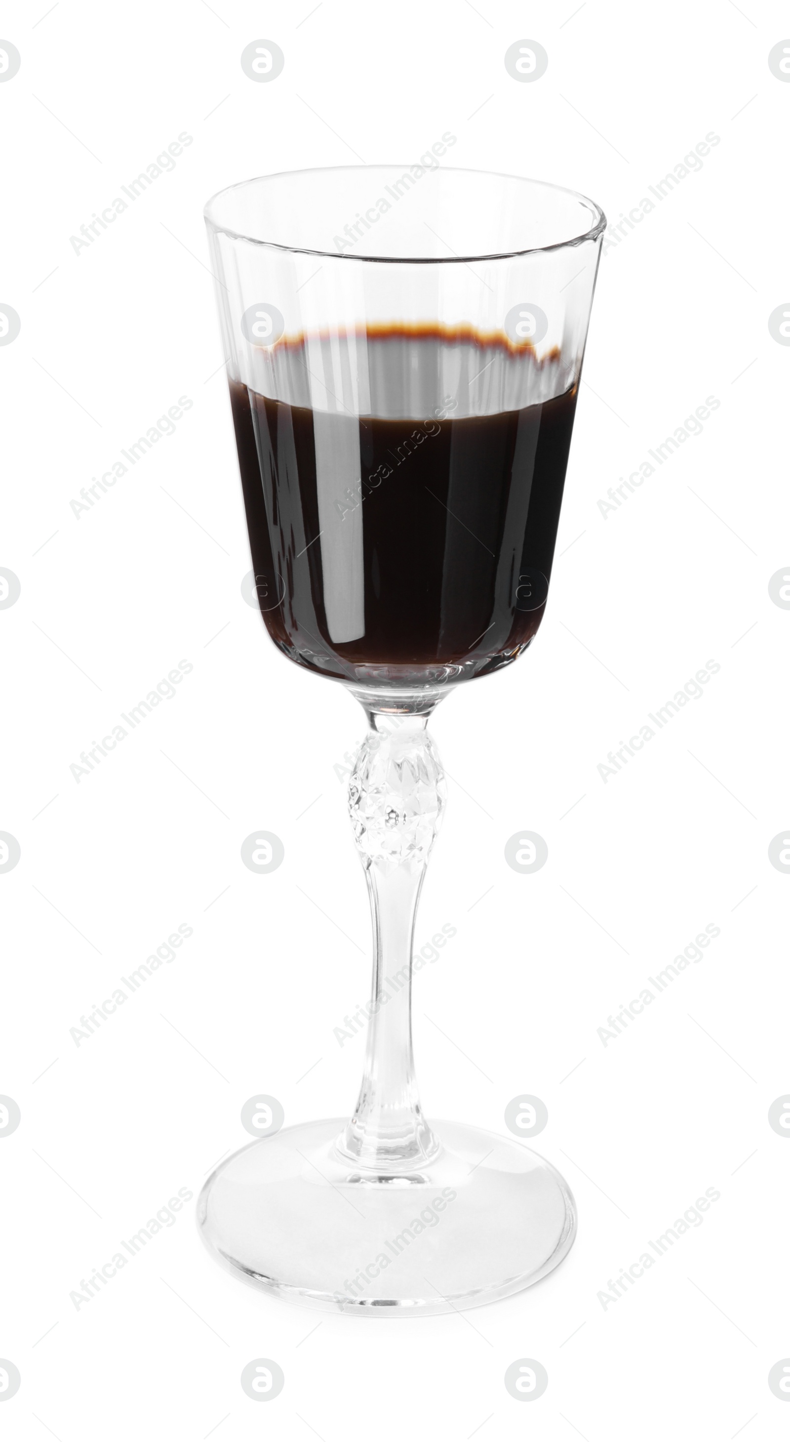 Photo of Shot glass with coffee liqueur isolated on white