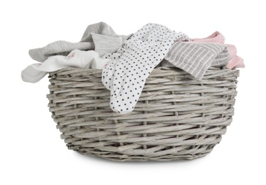 Photo of Wicker basket with baby clothes isolated on white