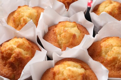 Photo of Delicious sweet muffins as background, closeup view