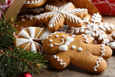 Tasty Christmas cookies on wooden table, closeup