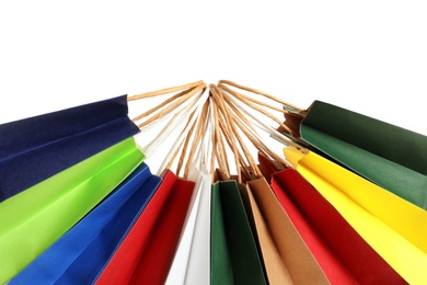 Photo of Colorful paper shopping bags on white background