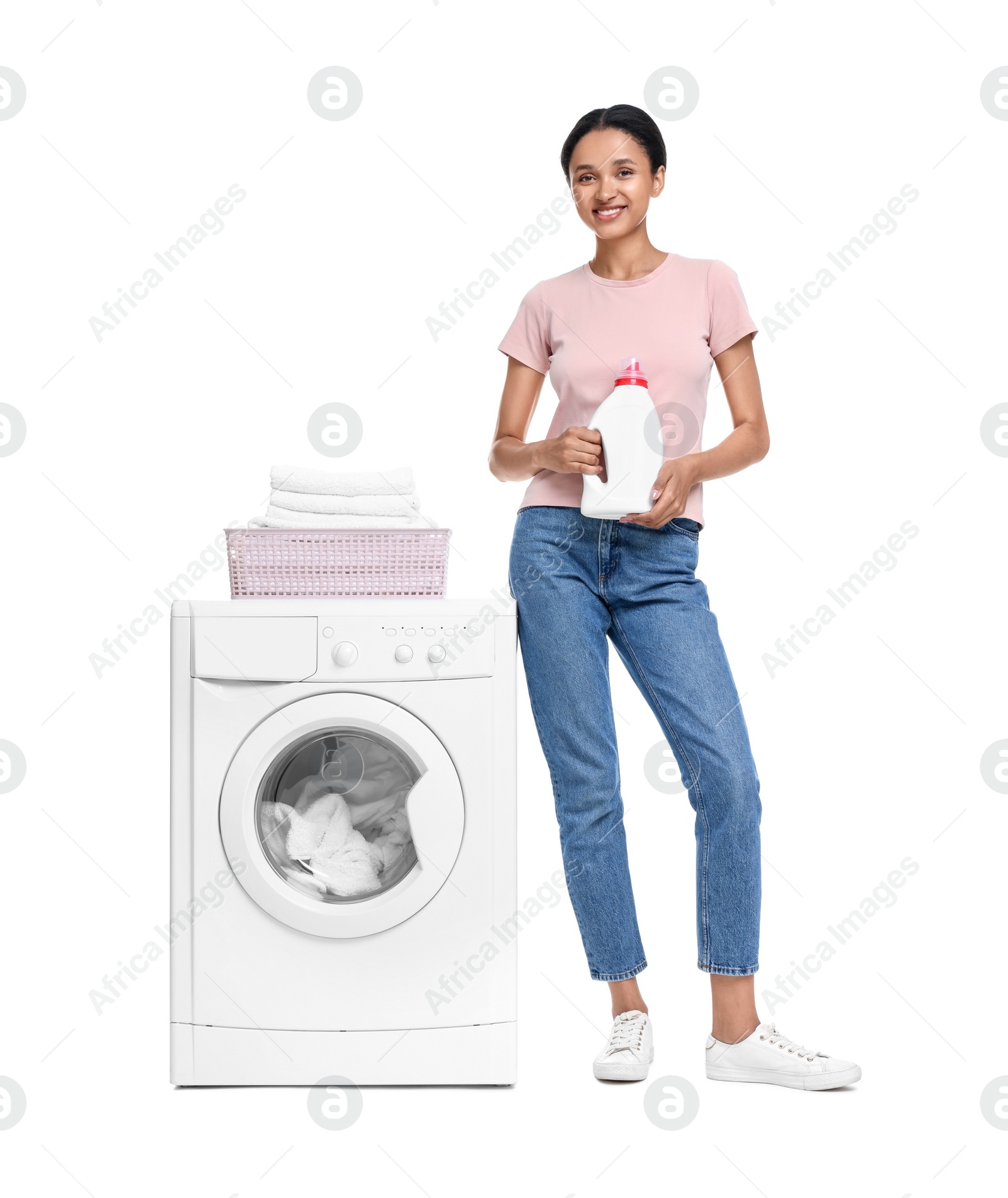 Photo of Beautiful woman with detergent near washing machine on white background