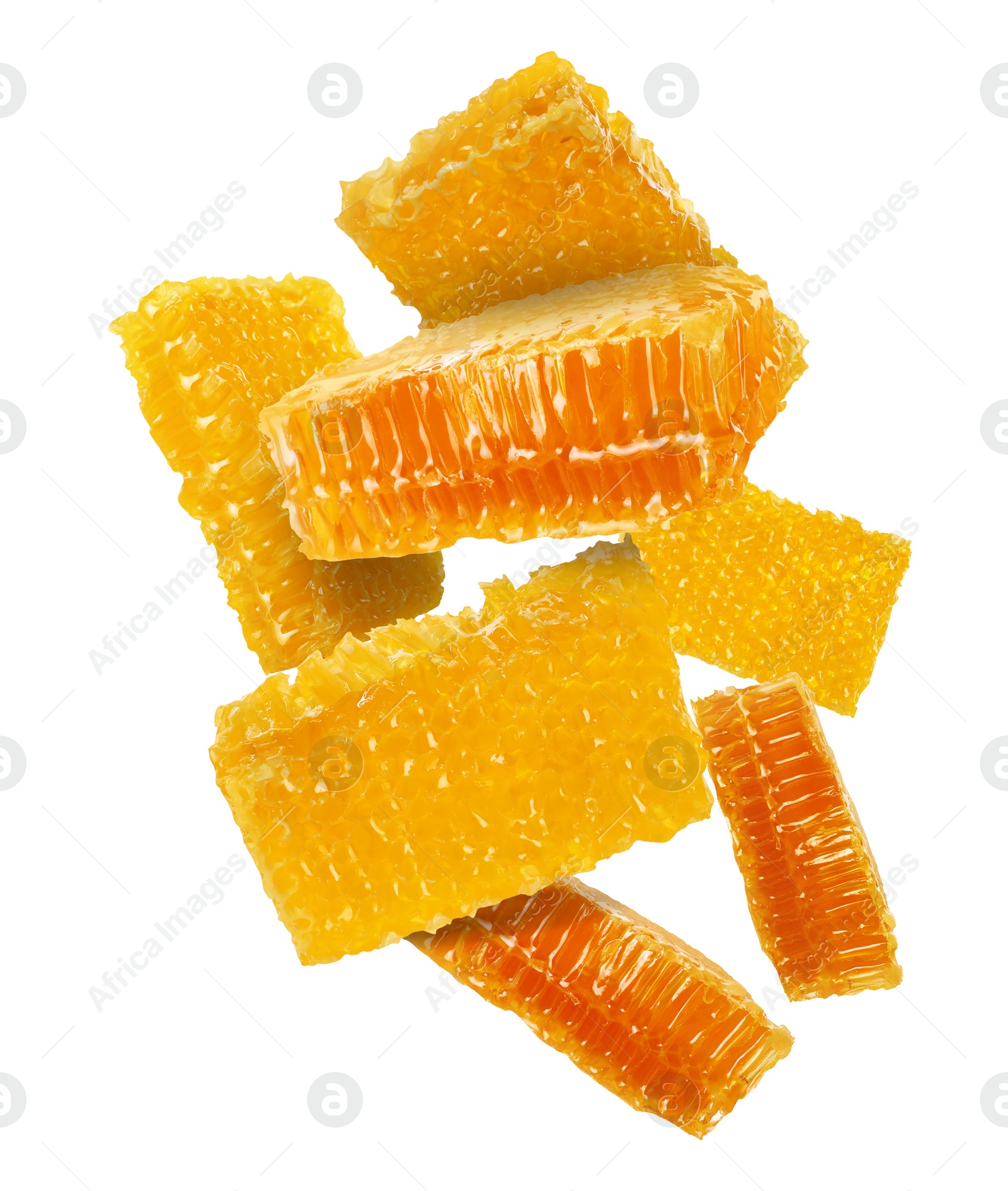 Image of Pieces of honeycomb falling on white background