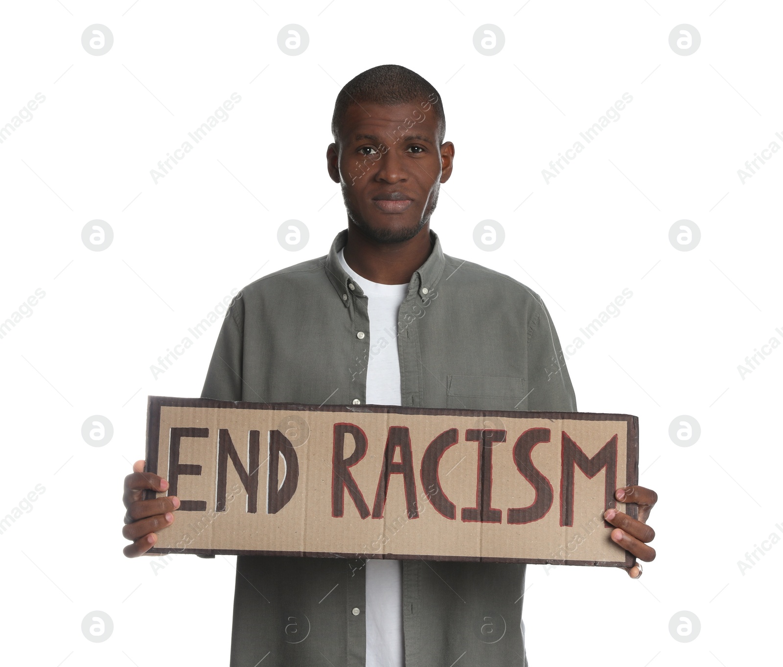 Photo of African American man holding sign with phrase End Racism on white background