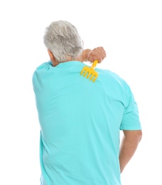 Mature man scratching back with toy rake on white background. Annoying itch