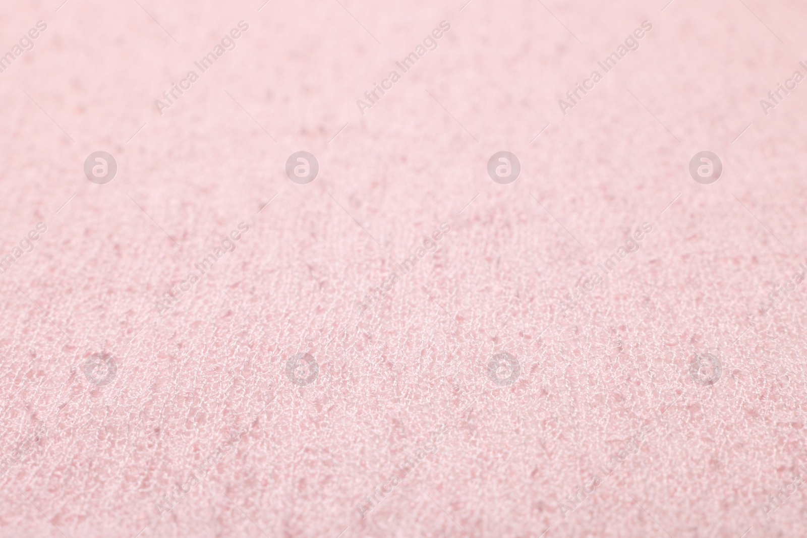 Photo of Texture of soft pink fabric as background, closeup
