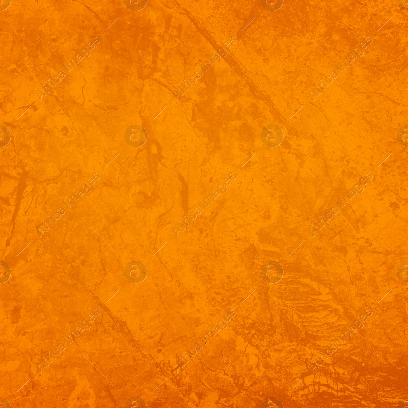 Image of Texture of stone surface painted in orange color as background