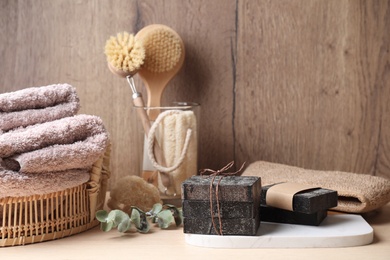 Photo of Composition with natural tar soap on wooden table