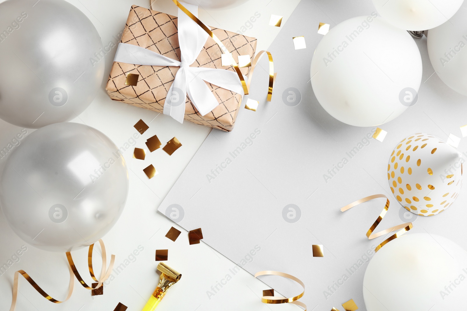 Photo of Flat lay composition with party accessories and space for text on light background