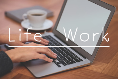 Woman with modern laptop at wooden table, closeup. Concept of balance between work and life