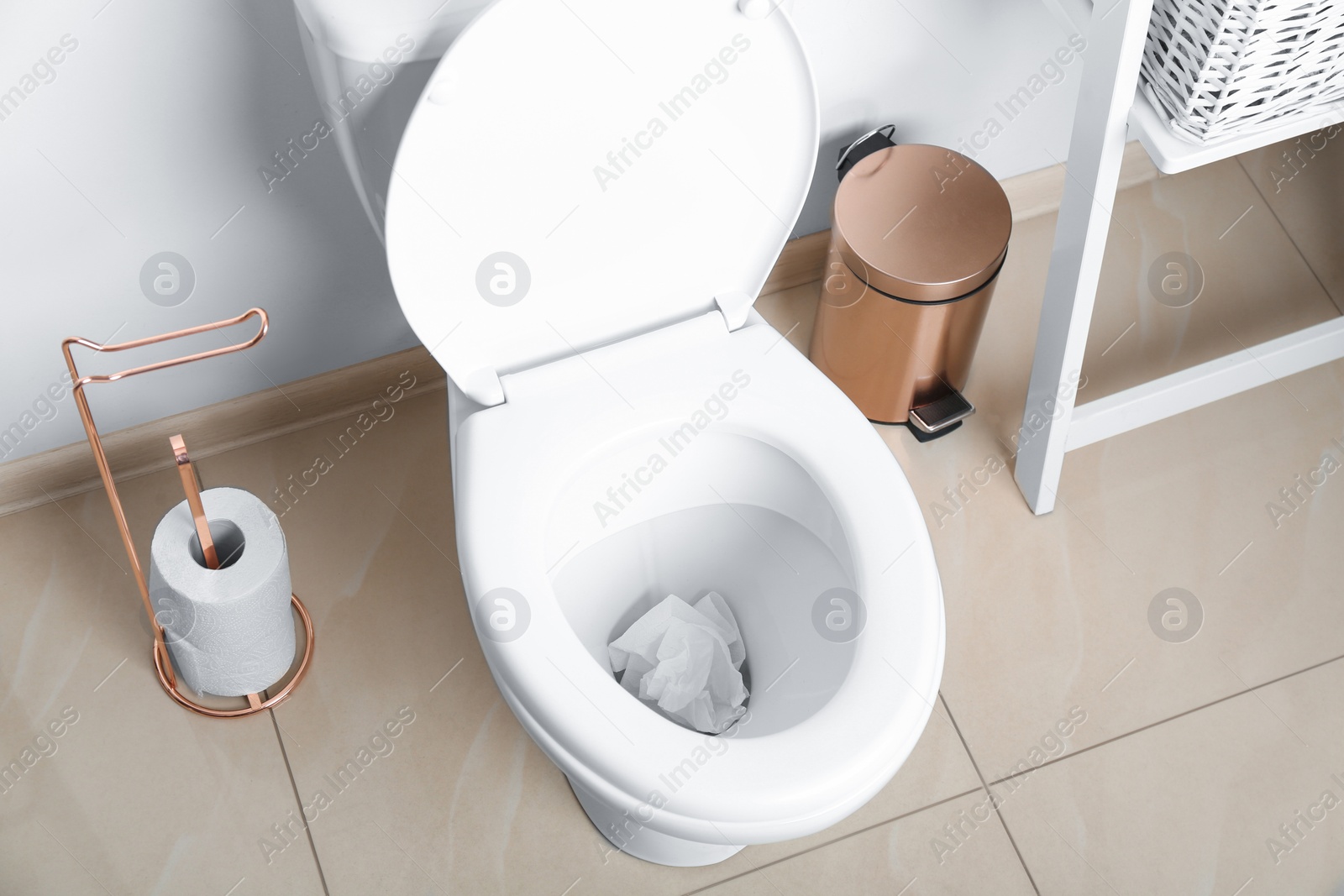 Photo of Sheets of paper in toilet bowl at home