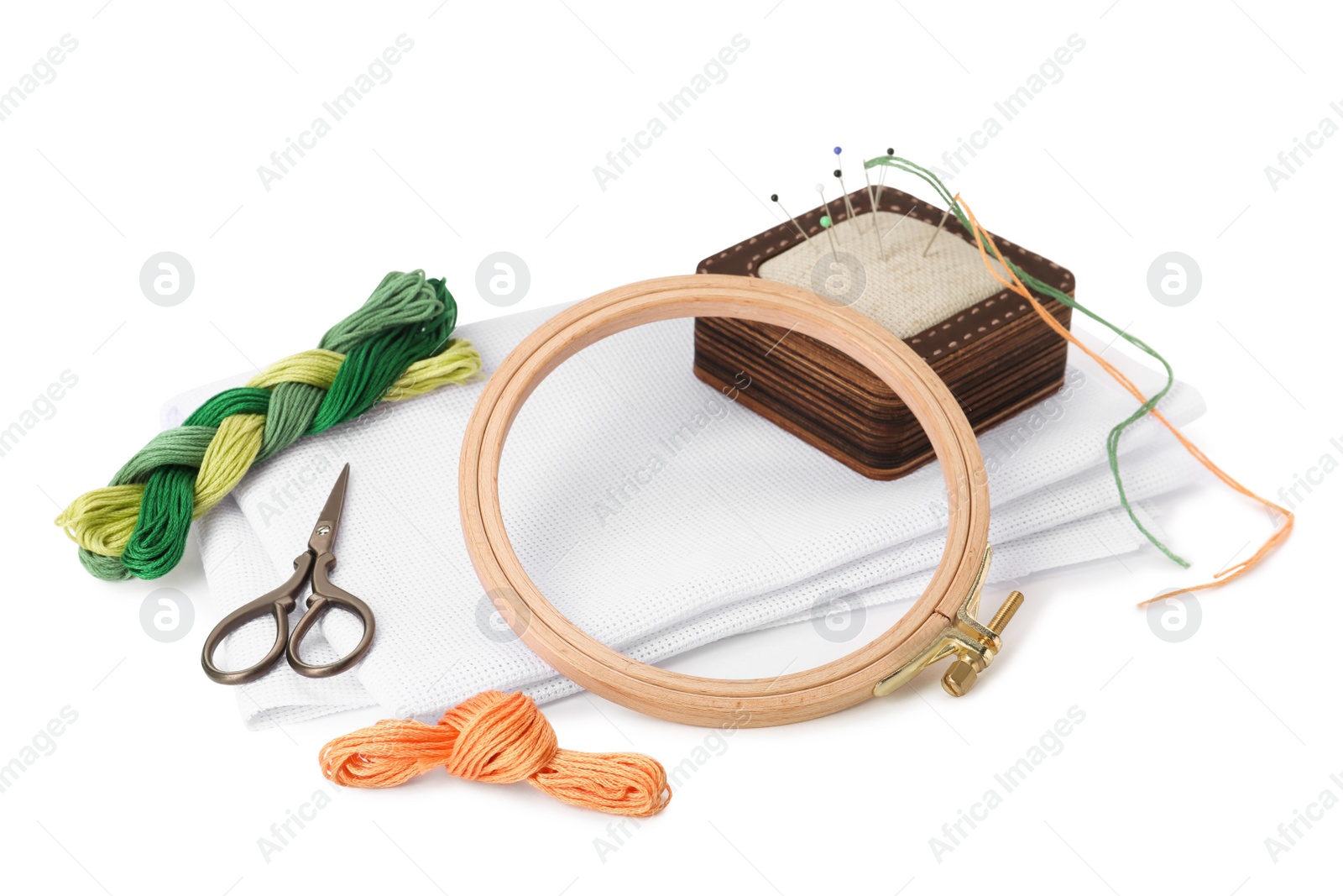 Photo of Set of embroidery equipment on white background