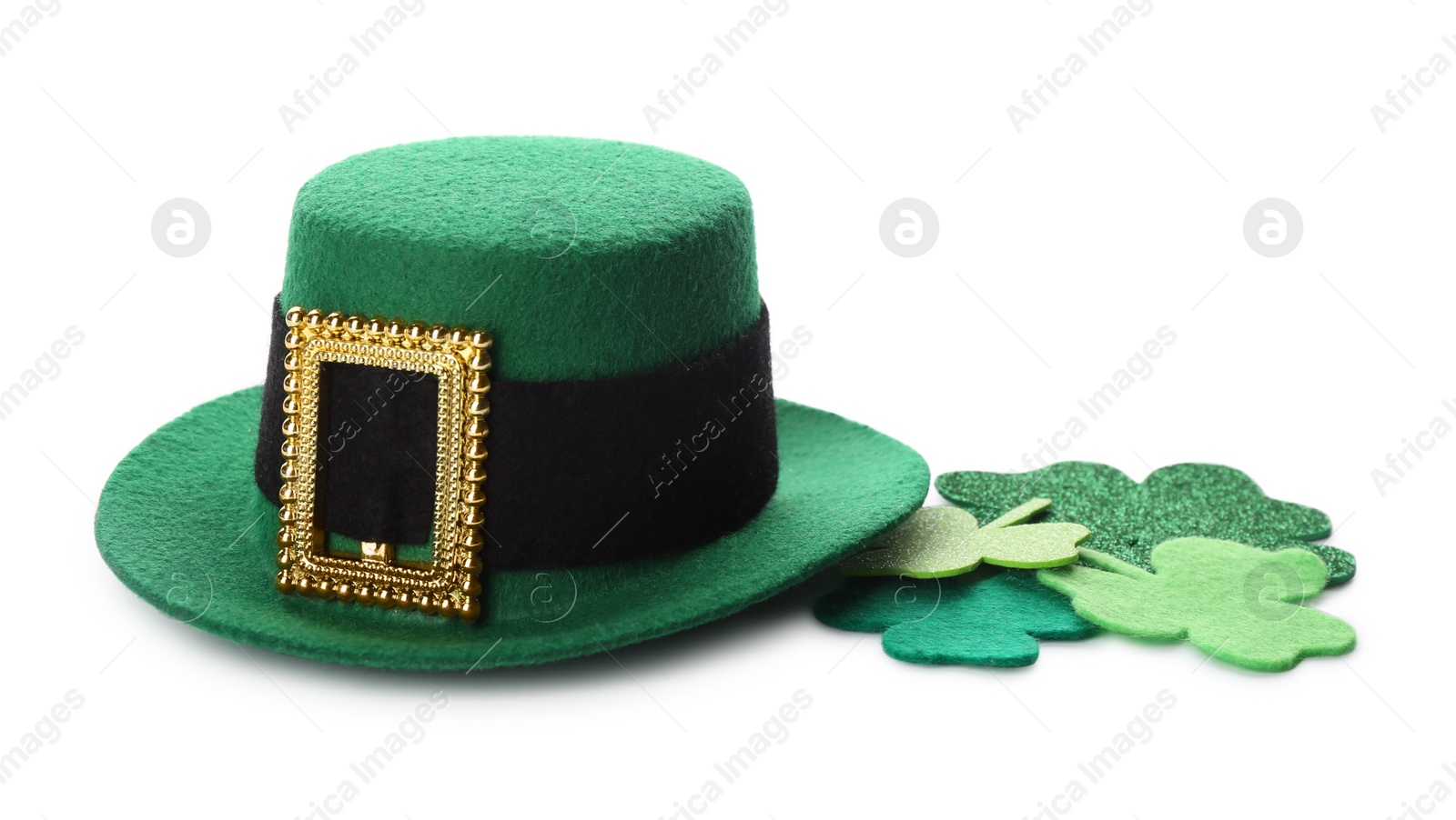 Photo of Leprechaun's hat and decorative clover leaves on white background. St. Patrick's day celebration