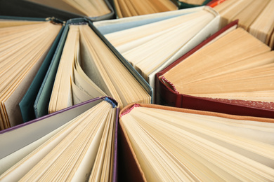 Photo of Many different hardcover books as background, closeup