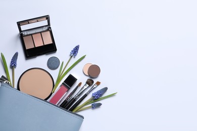 Photo of Flat lay composition with different makeup products and beautiful flowers on white background, space for text