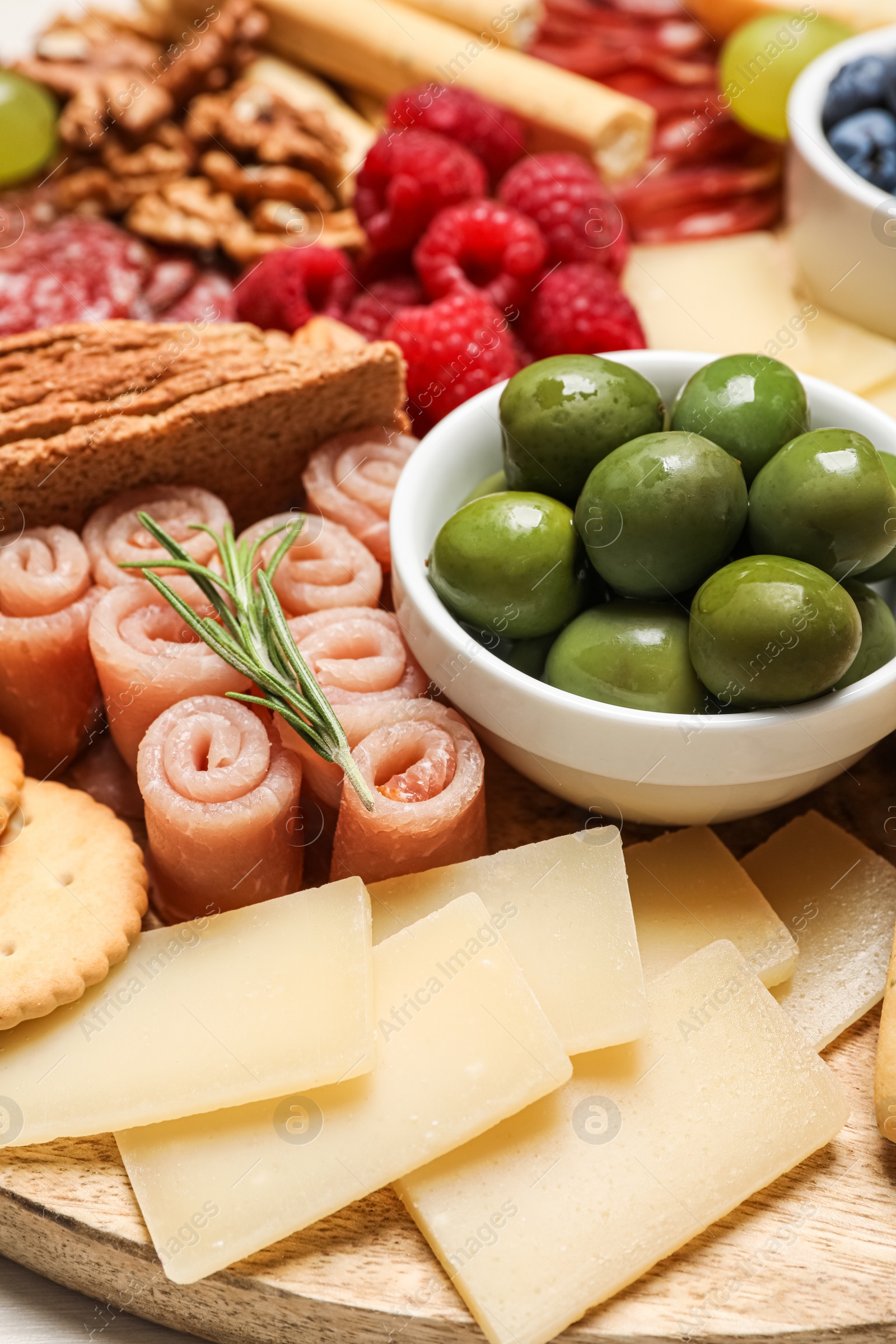 Photo of Tasty parmesan cheese and other different appetizers, closeup